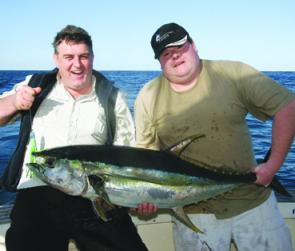 Spring on the South Coast is yellowfin time. Steve Sharpe and Darren Tickner with a 25kgfish taken on a lumo green Hollowpoint Tuna Terror aboard The Enforcer. 